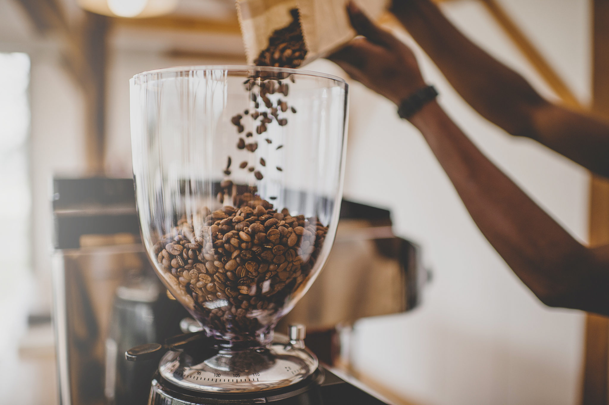 Pouring Coffee Beans into Hopper