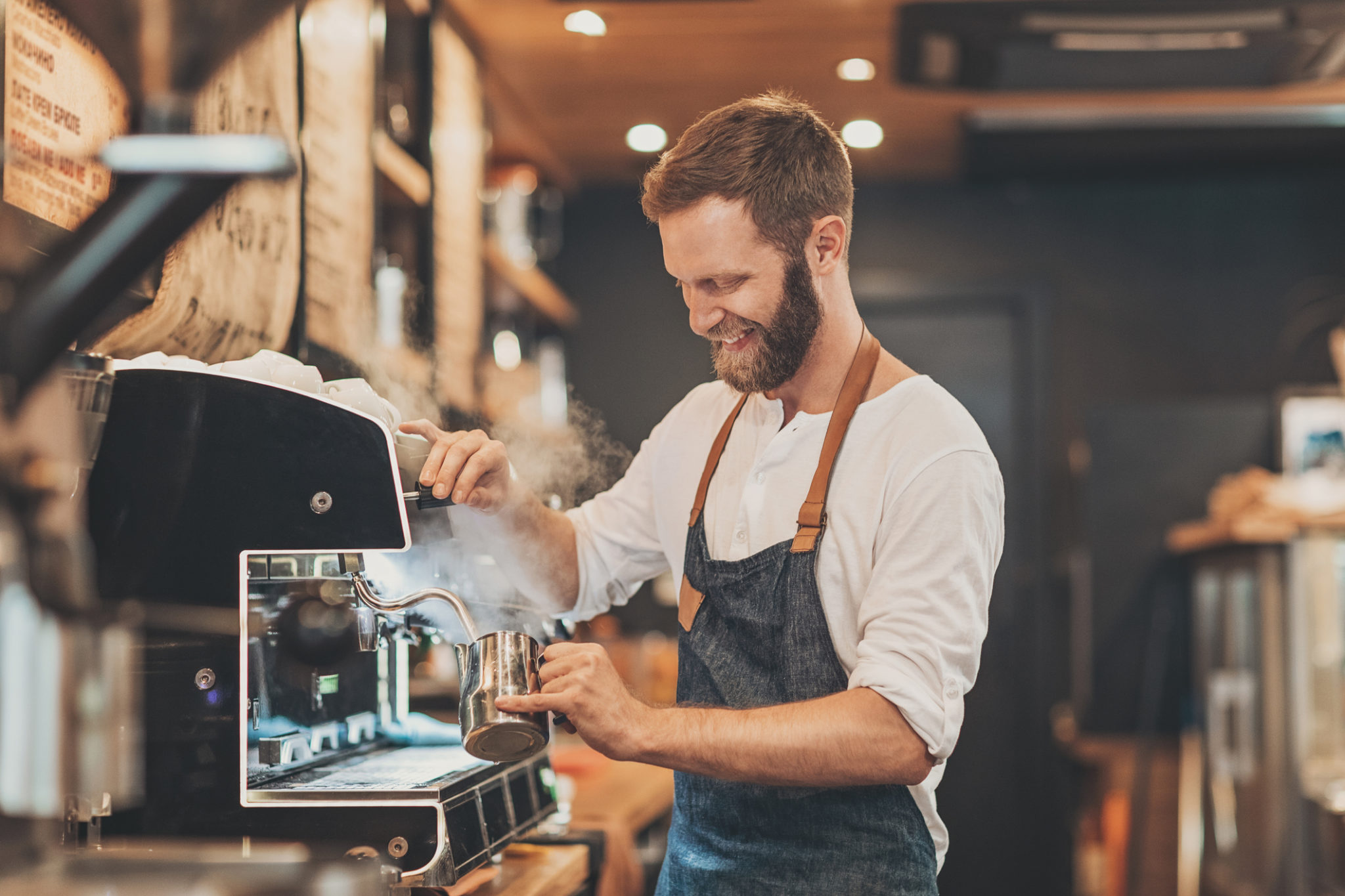 Barista Steaming Milk for Latte